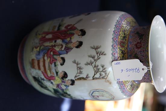A pair of Chinese famille rose lantern shaped vases, height 29cm, wood stands